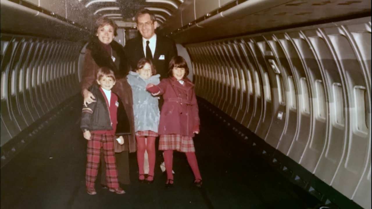 a family boarding a plane
